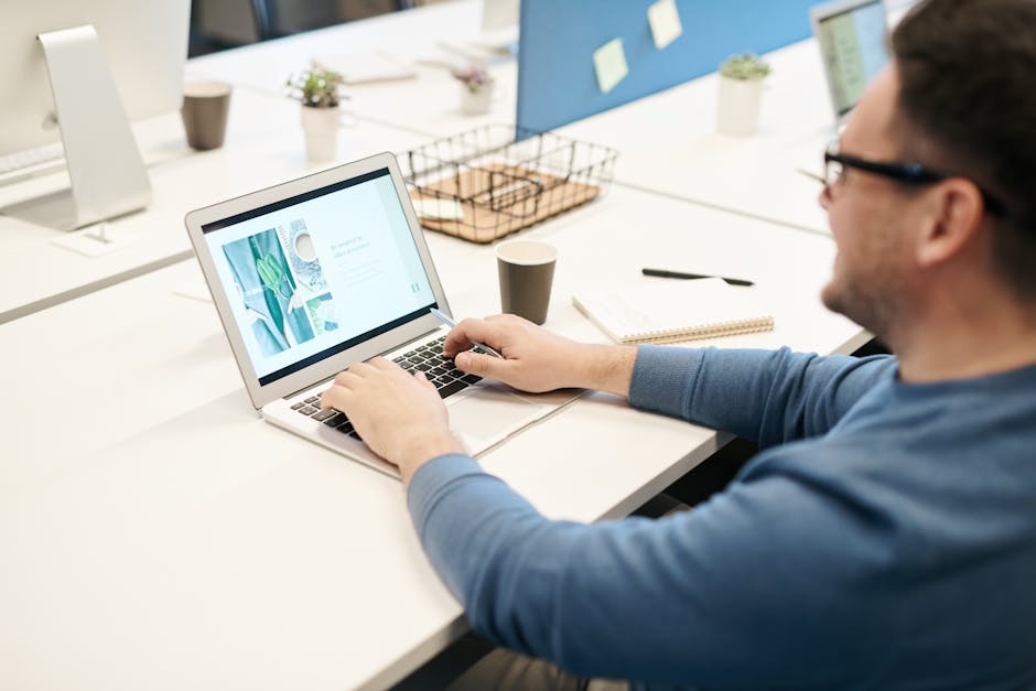 Person typing on laptop in modern focused workspace
